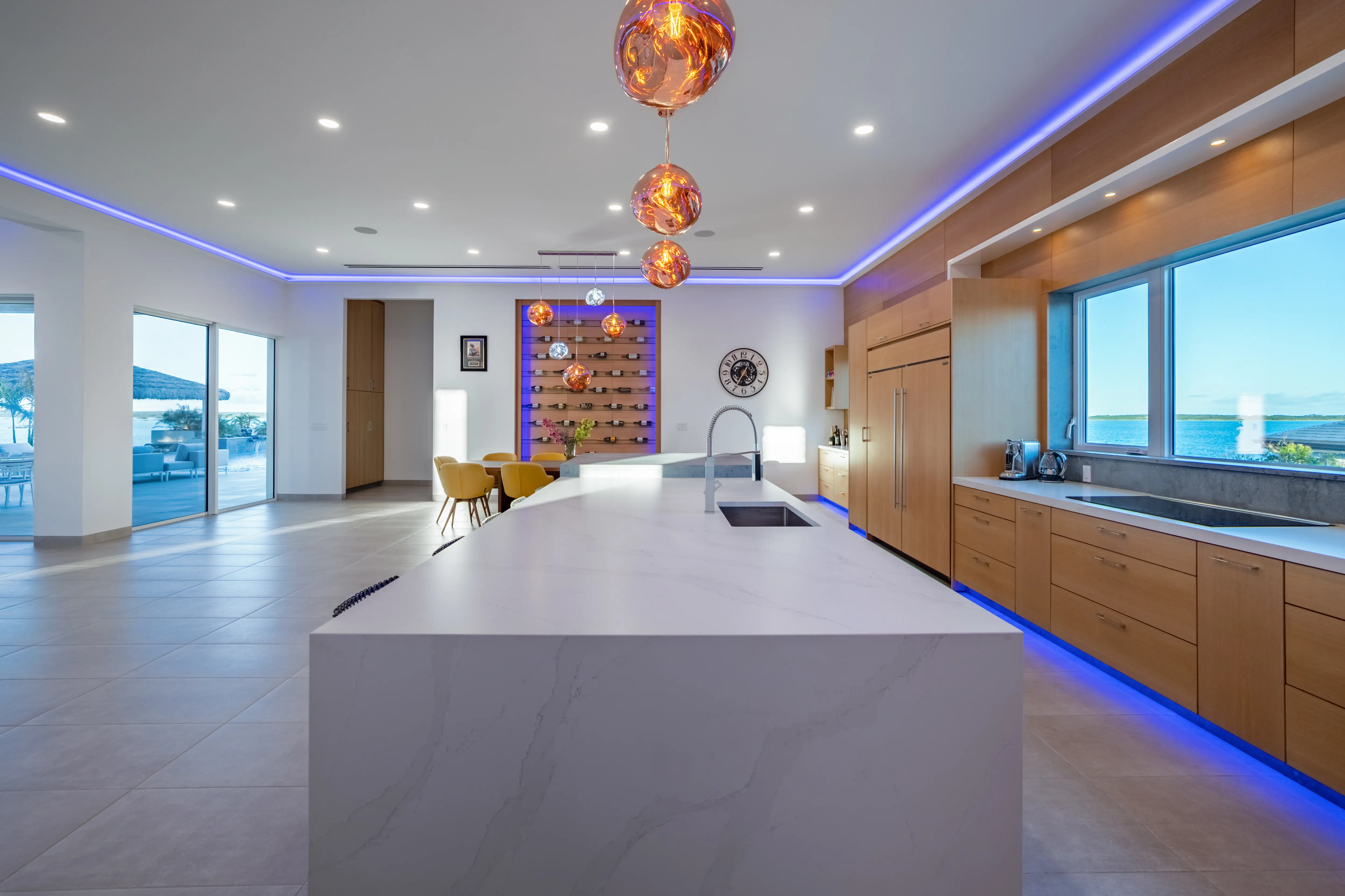 Gourmet kitchen with copper pendants